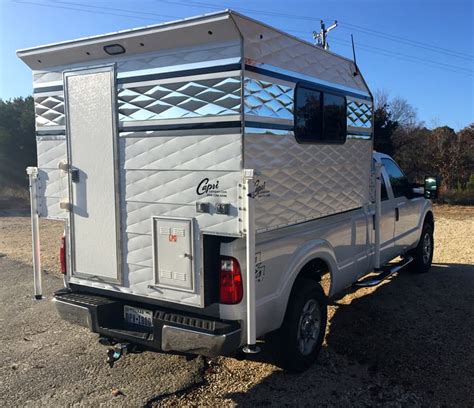 Compared to a Four Wheel Camper Shell Model (13,895 MSRP), Project M is 4,100 less and 400 to 475-pounds less weight. . Capri truck campers